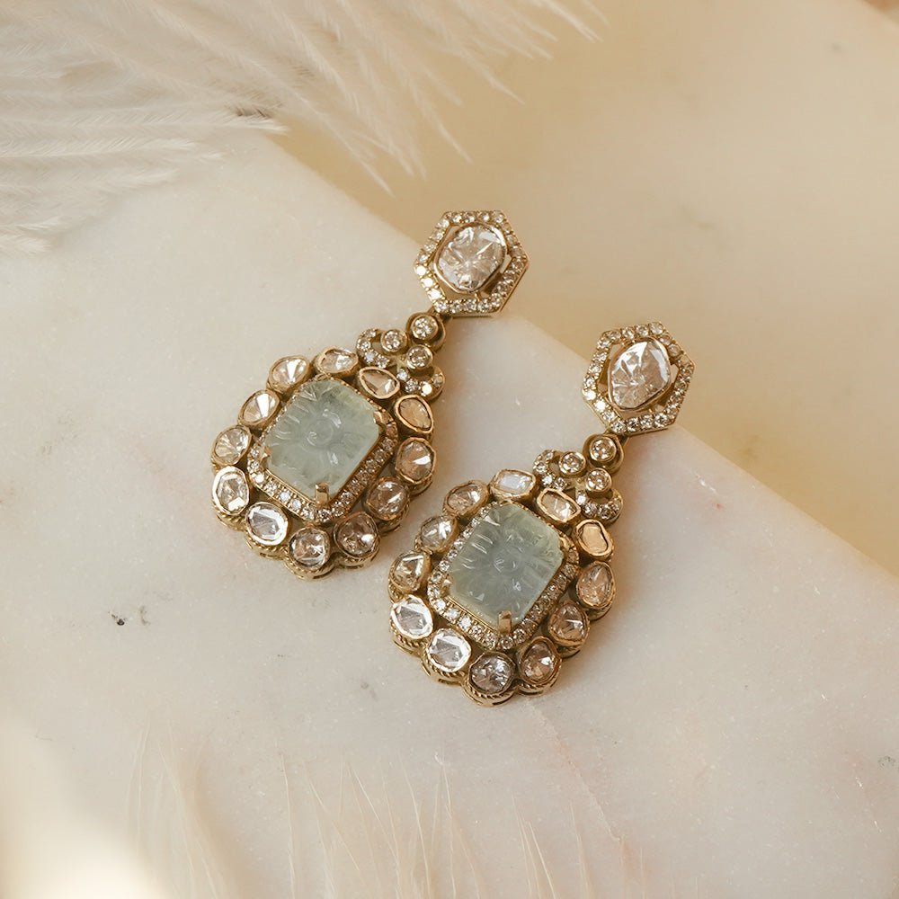 Jewelry shot of Victorian earrings in aquamarine-blue stones and polki artisan technique.