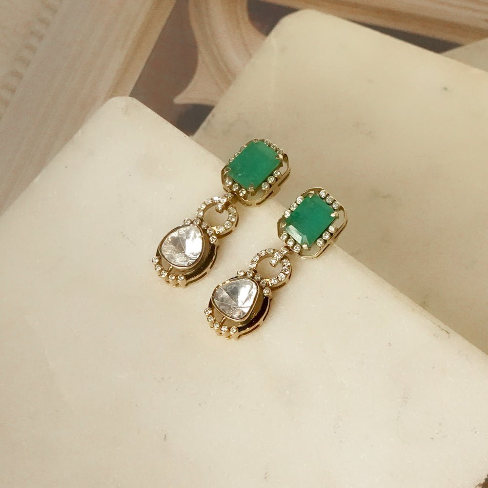 Jewelry-only photo of Emerald Aura earrings in concentric emerald-polki halo with yellow gold finish.