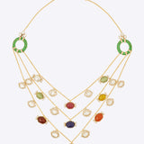 14K gold necklace with Navratna stones and Polki diamonds in a layered design.