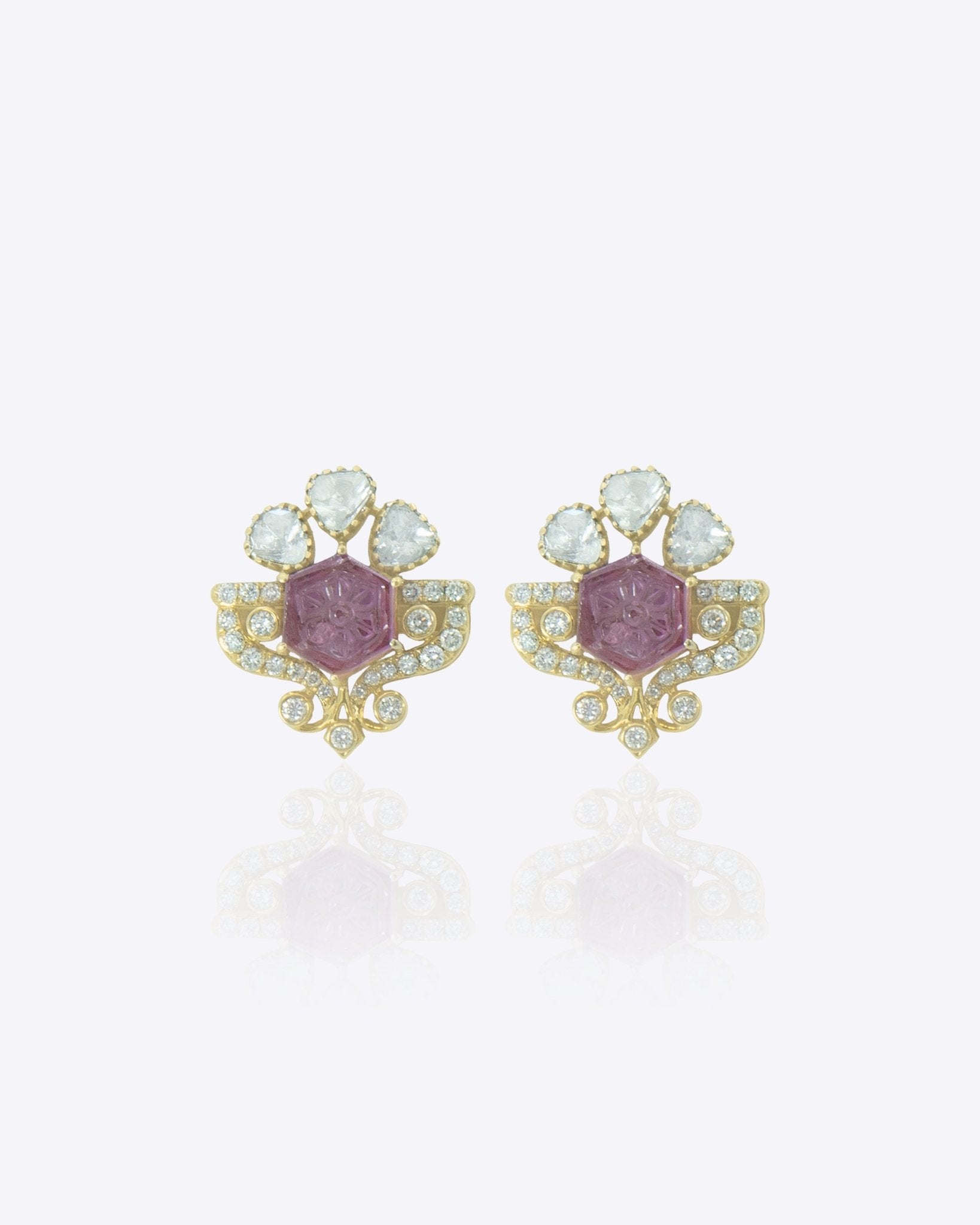 14K gold Mughal Muse earrings with Polki diamonds in a classic motif.