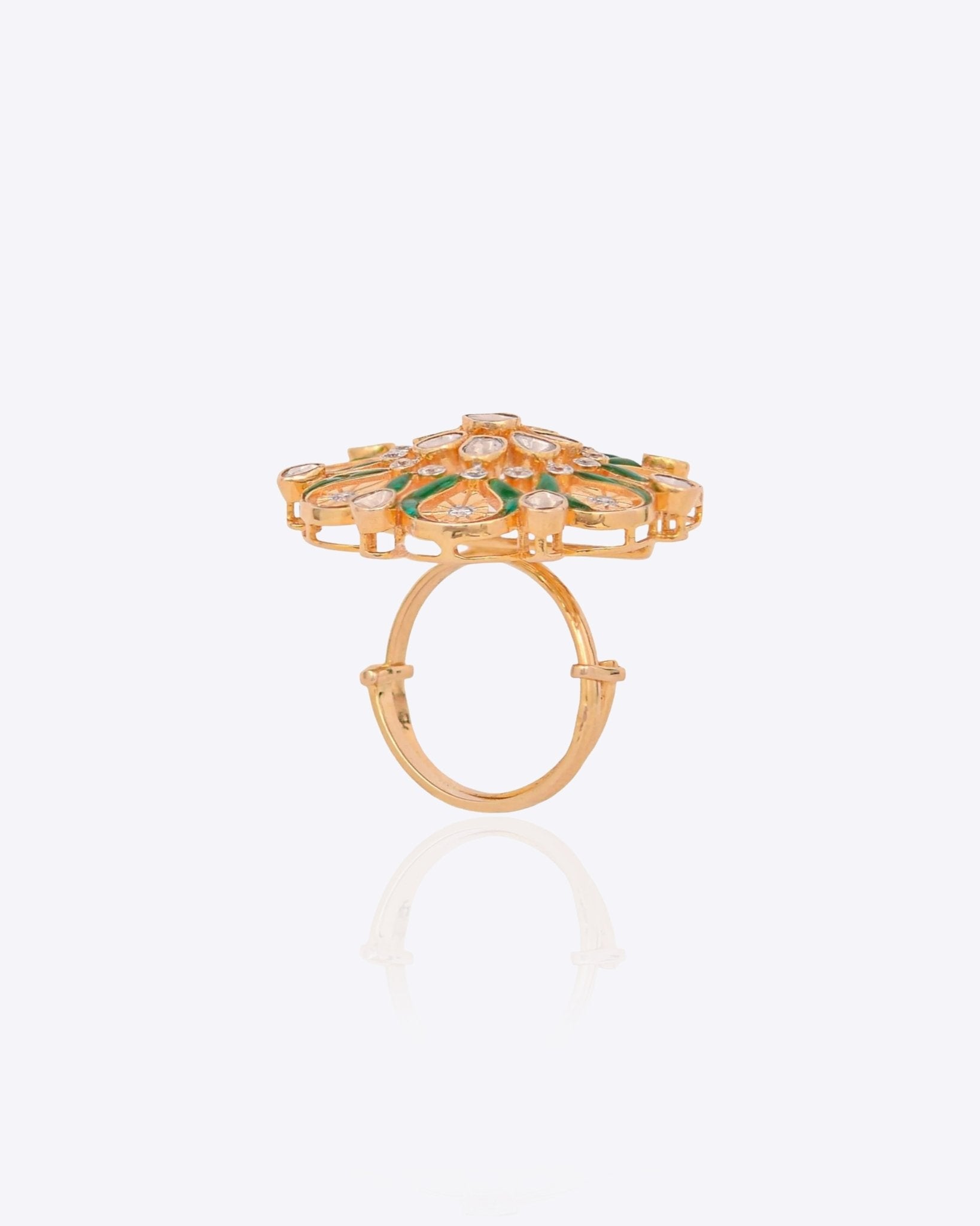 14K gold ring with a green talaf stone centerpiece and Polki diamonds.