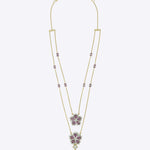 14K gold Petal Pair Necklace with tourmaline and layered floral motifs.