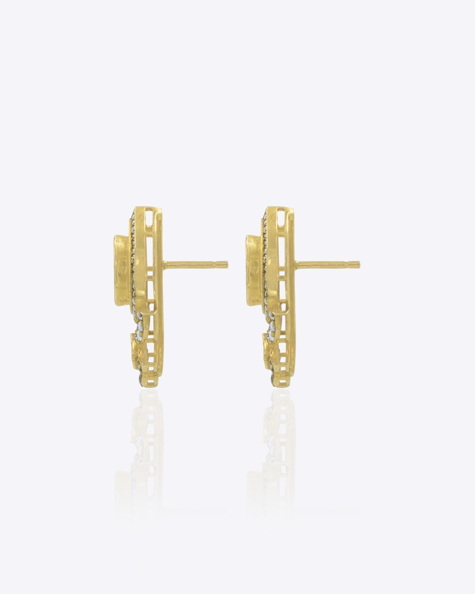 14K gold earrings with Polki and diamond oval layering for festive sparkle.