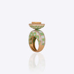 Gold ring with vibrant enamel detailing in a smooth, graceful band.