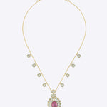 14K gold necklace with a central oval motif and delicate petal detailing.