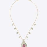 14K gold necklace with a central oval motif and delicate petal detailing.