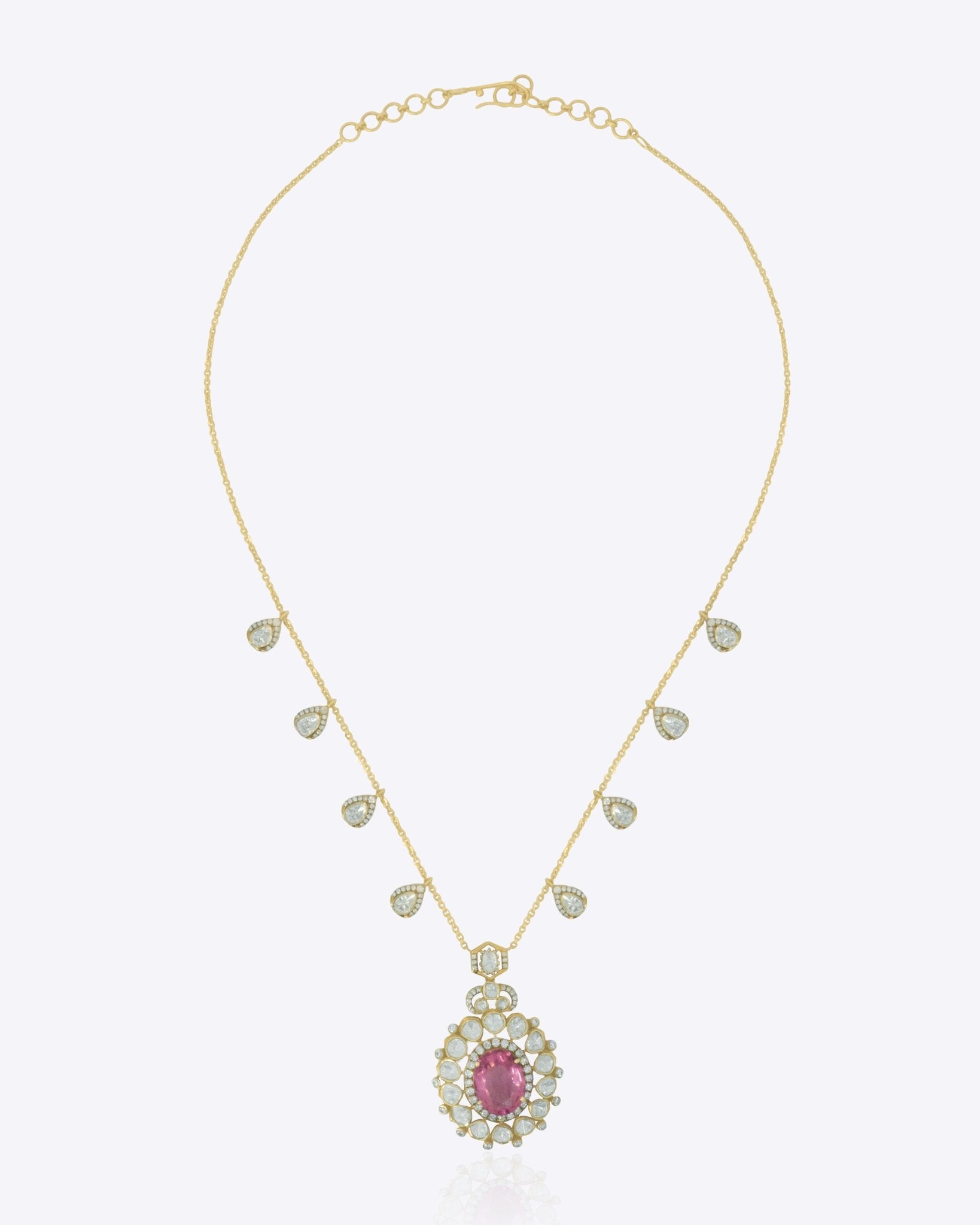 14K gold necklace with a central oval motif and delicate petal detailing.