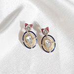 Radiant Polki diamond earrings in 18K gold with talaf stone framing.