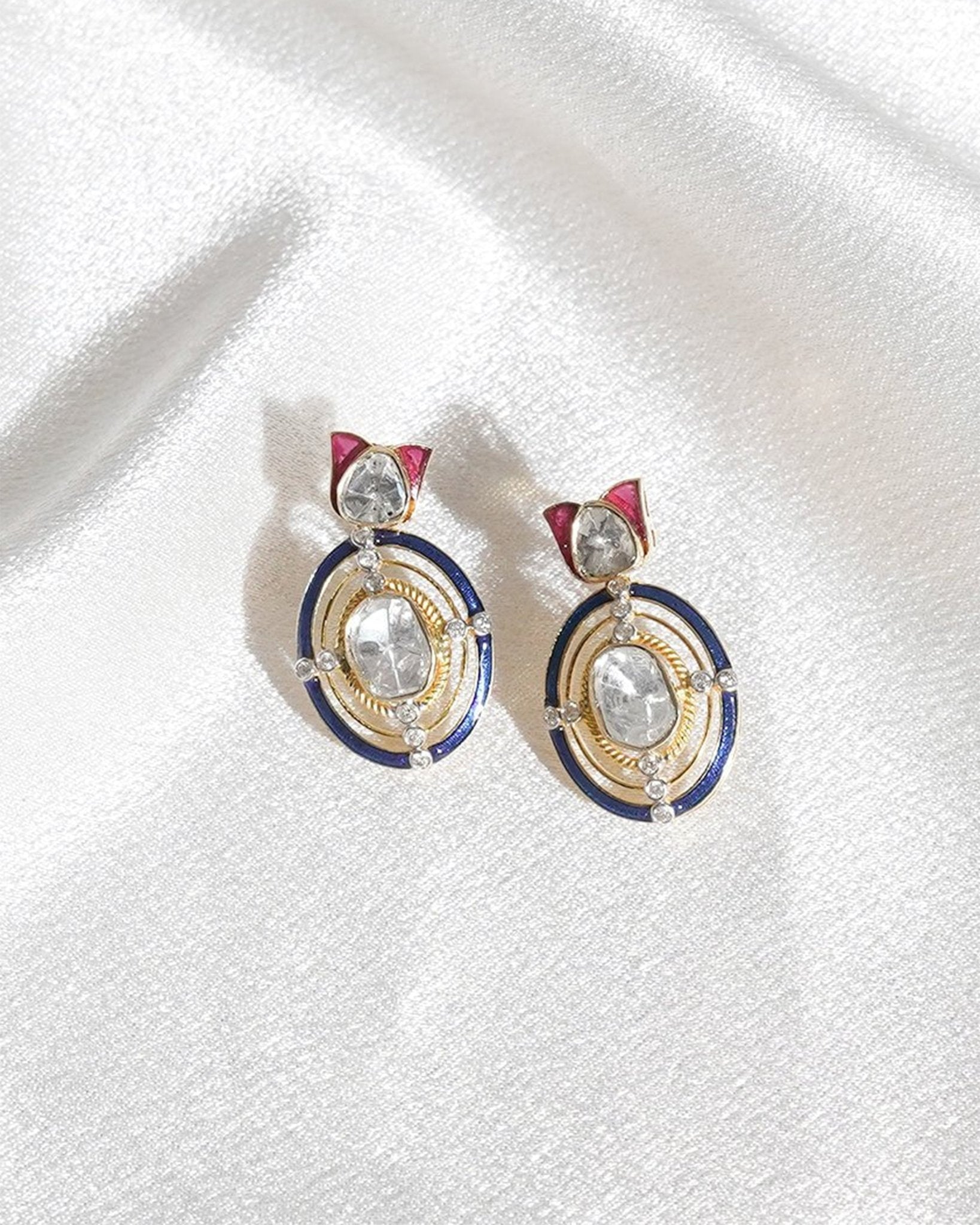 Radiant Polki diamond earrings in 18K gold with talaf stone framing.