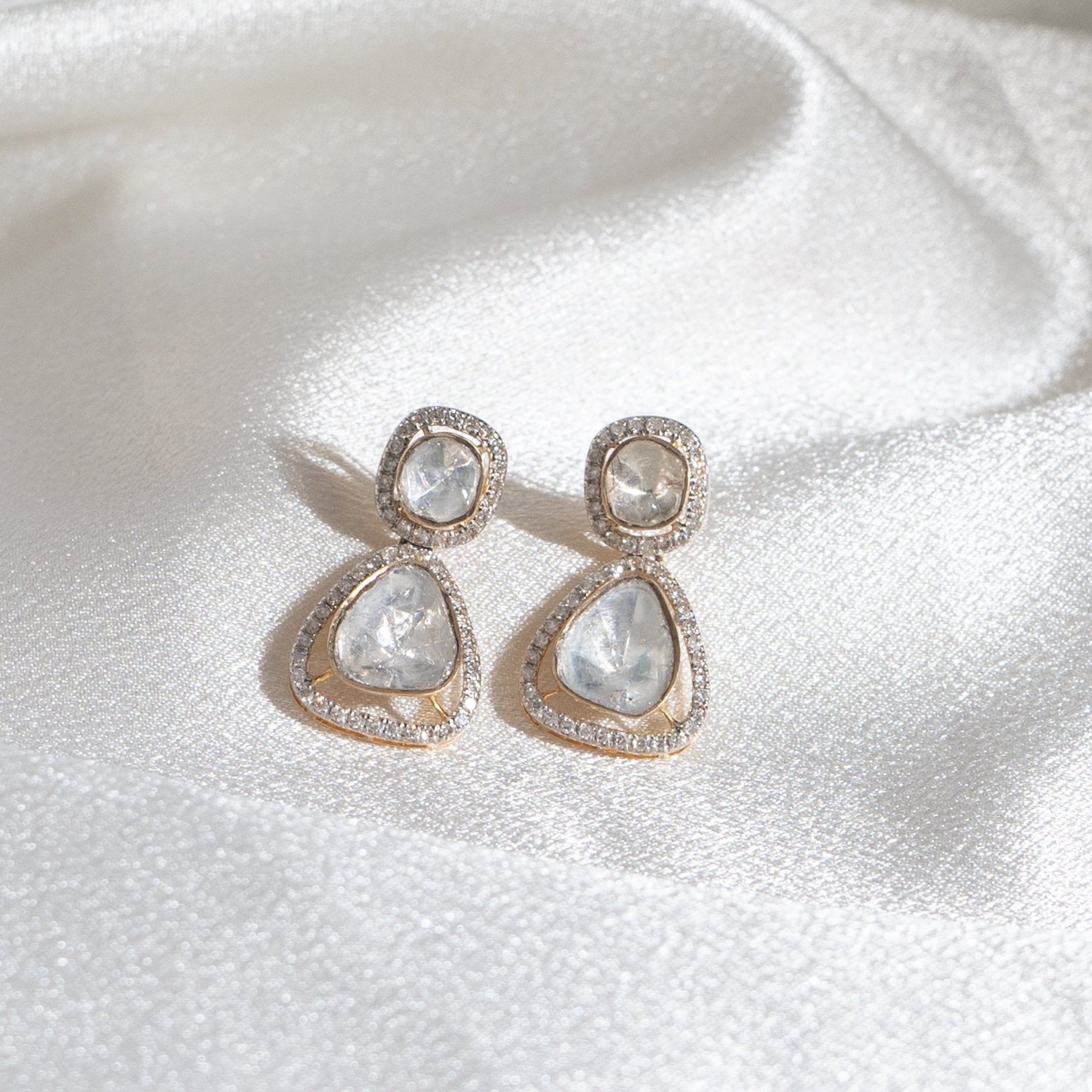 Elegant capture of Mesmera Polki Drop Earrings in vintage shape and radiant gemstone layering.