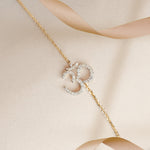 Veer Diamond Bracelet in 14K gold with Om motif and Polki diamond detailing.
