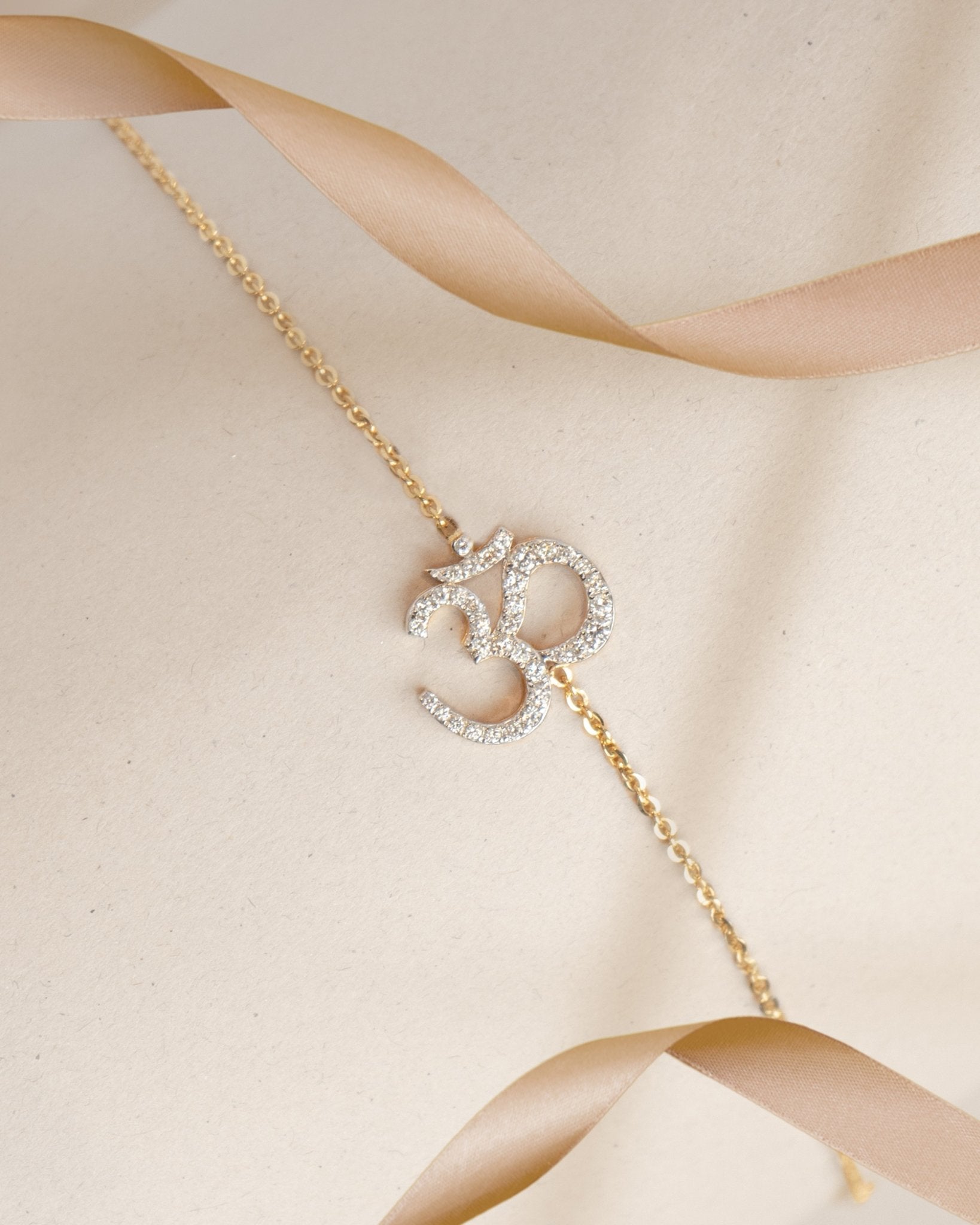 Veer Diamond Bracelet in 14K gold with Om motif and Polki diamond detailing.