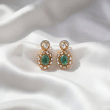 14k gold earrings with emerald studs, diamonds, and Polki drop