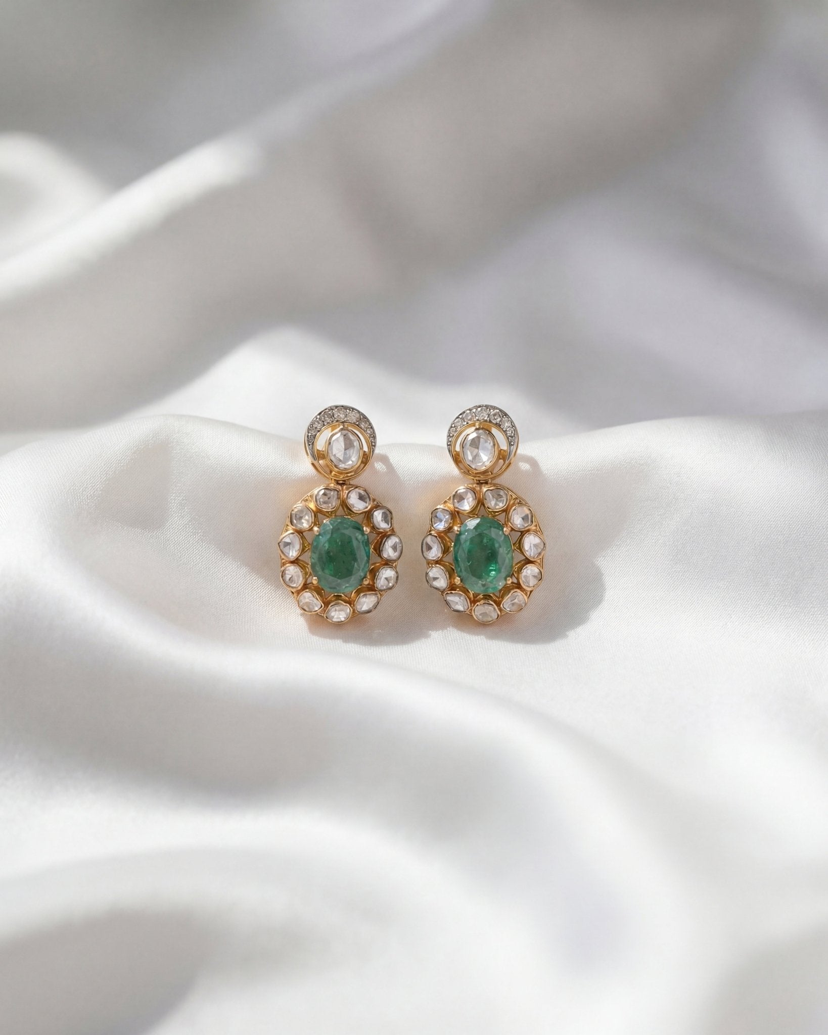 14k gold earrings with emerald studs, diamonds, and Polki drop
