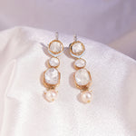 Elegant Pearl & Grace Diamond Polki Earrings with round and square diamonds in a drooping design.