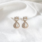 Elegant drop earrings with small polki diamonds, radiating brilliance.