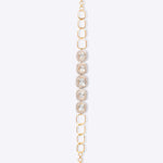 Minimalist's Dream Bracelet in 14k gold with open links and bezel-set Polki diamonds.