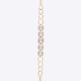 Minimalist's Dream Bracelet in 14k gold with open links and bezel-set Polki diamonds.