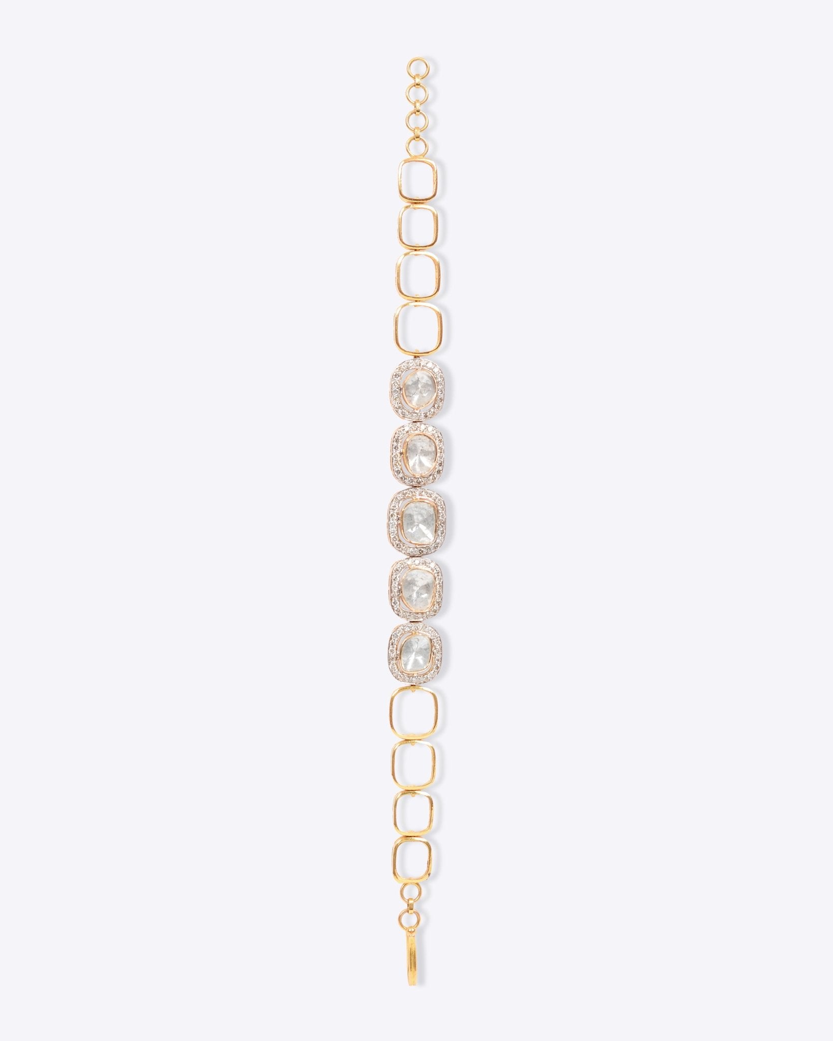 Minimalist's Dream Bracelet in 14k gold with open links and bezel-set Polki diamonds.