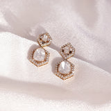 Polki Diamond Earrings in 14k gold with hexagonal structure, polki center, diamond halo, and talaf stone