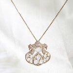 14K gold necklace with intertwining rubies, diamonds, rose cut diamonds, and polki