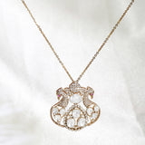 14K gold necklace with intertwining rubies, diamonds, rose cut diamonds, and polki