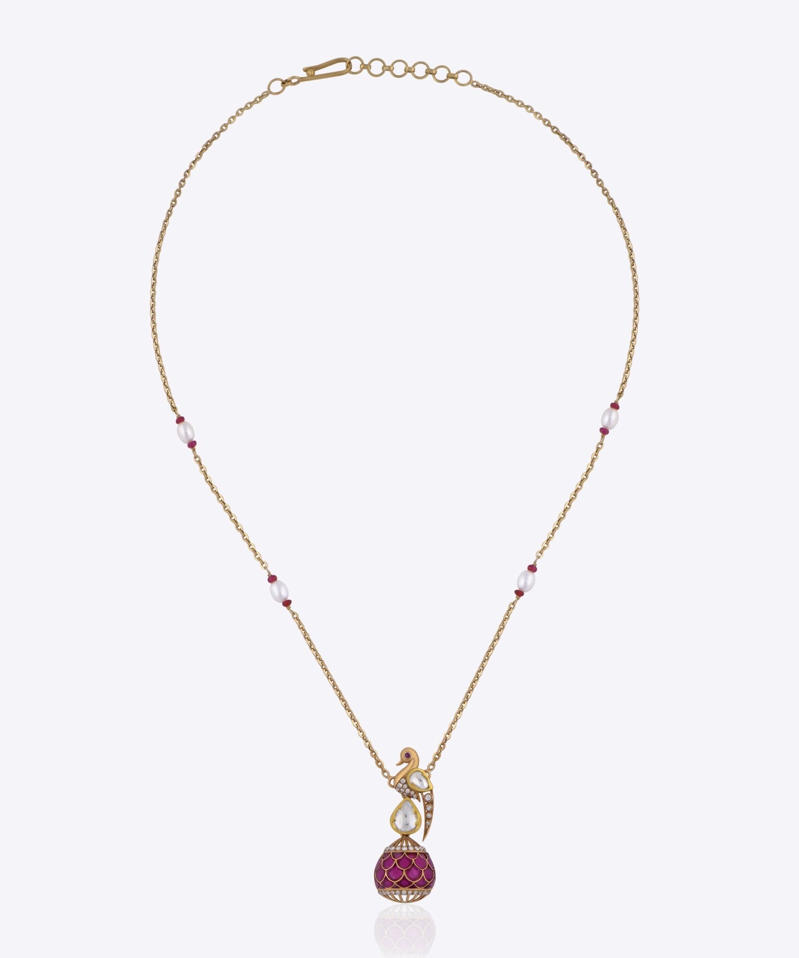 9K gold Mayur Noor Pendant featuring Polki diamonds and a pink gemstone drop, inspired by elegance and grace.