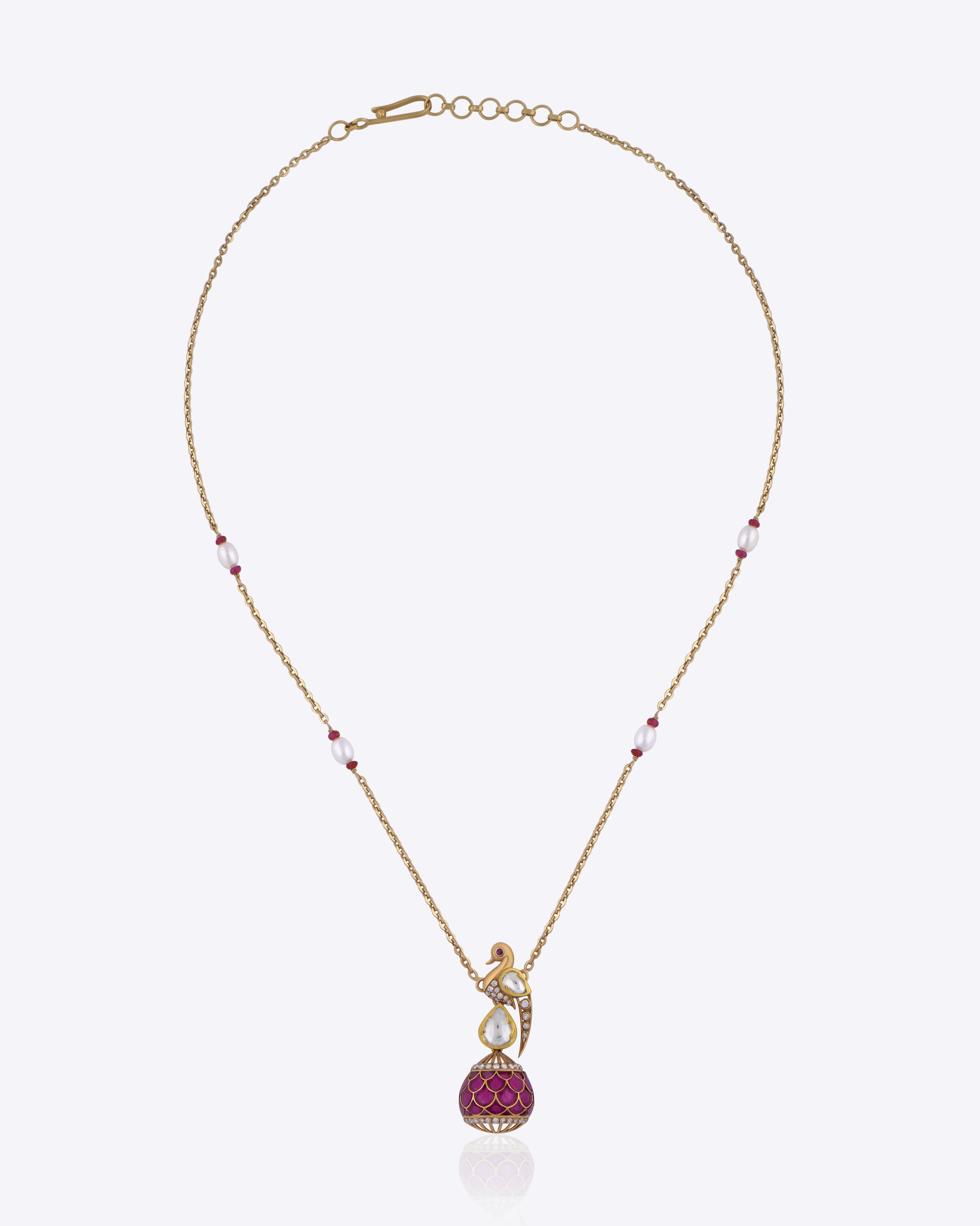 9K gold Mayur Noor Pendant featuring Polki diamonds and a pink gemstone drop, inspired by elegance and grace.