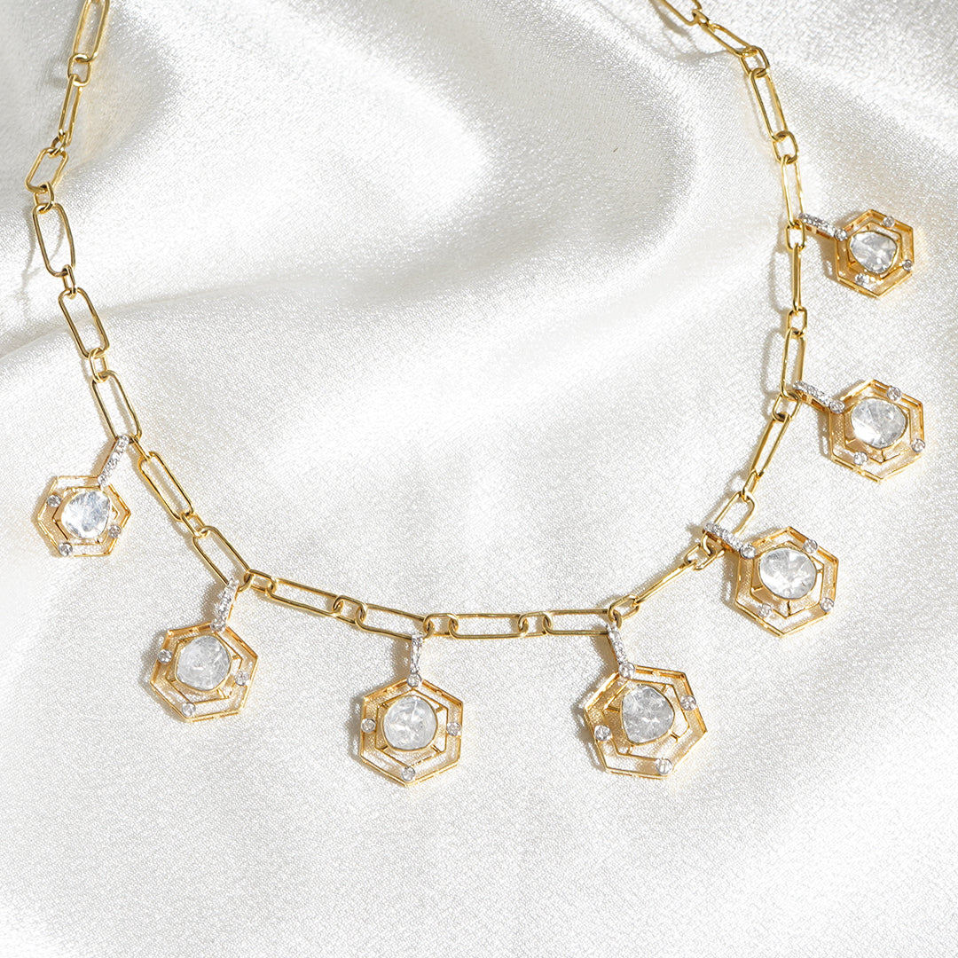 Opulent and elegant, this 14k gold necklace features five dazzling polki diamonds surrounded by petite diamonds.