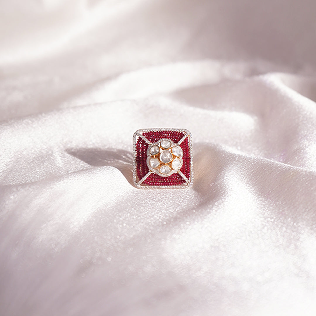 Sangria Polki Diamond Ring: 14k gold masterpiece. Rectangular frame encases harmonious rubies and polki, complemented by a diamond halo.