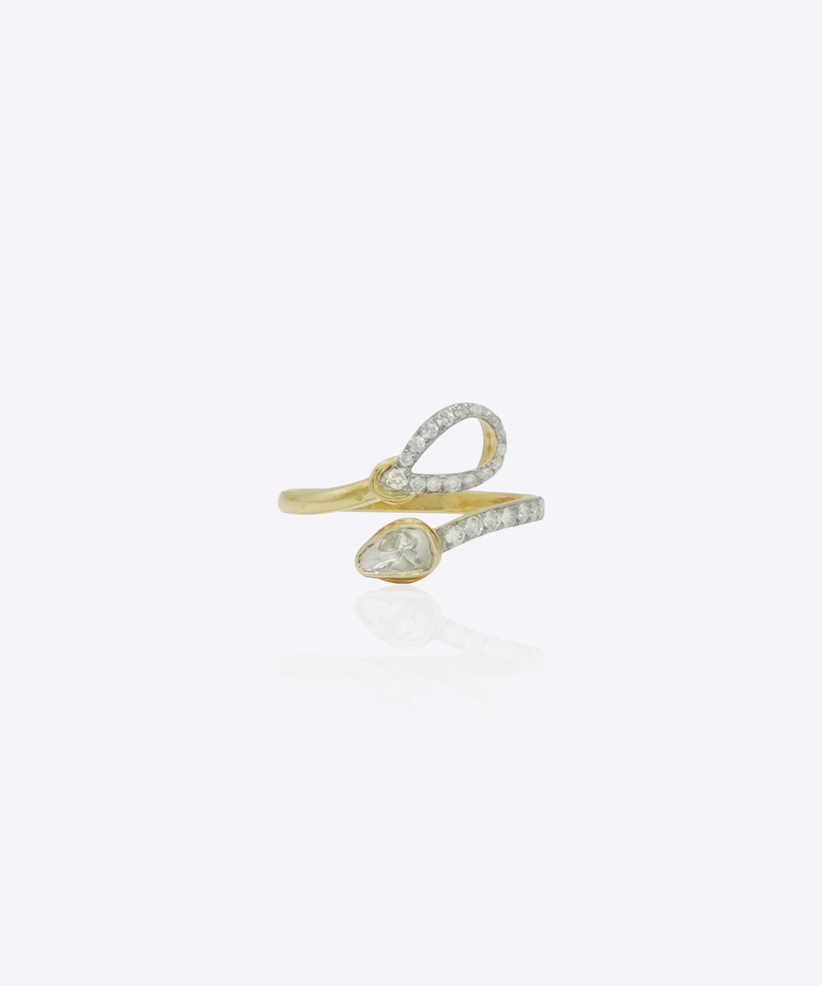 14kt gold ring featuring a modern open-band design with a stone-studded loop and a pear-shaped centerpiece.