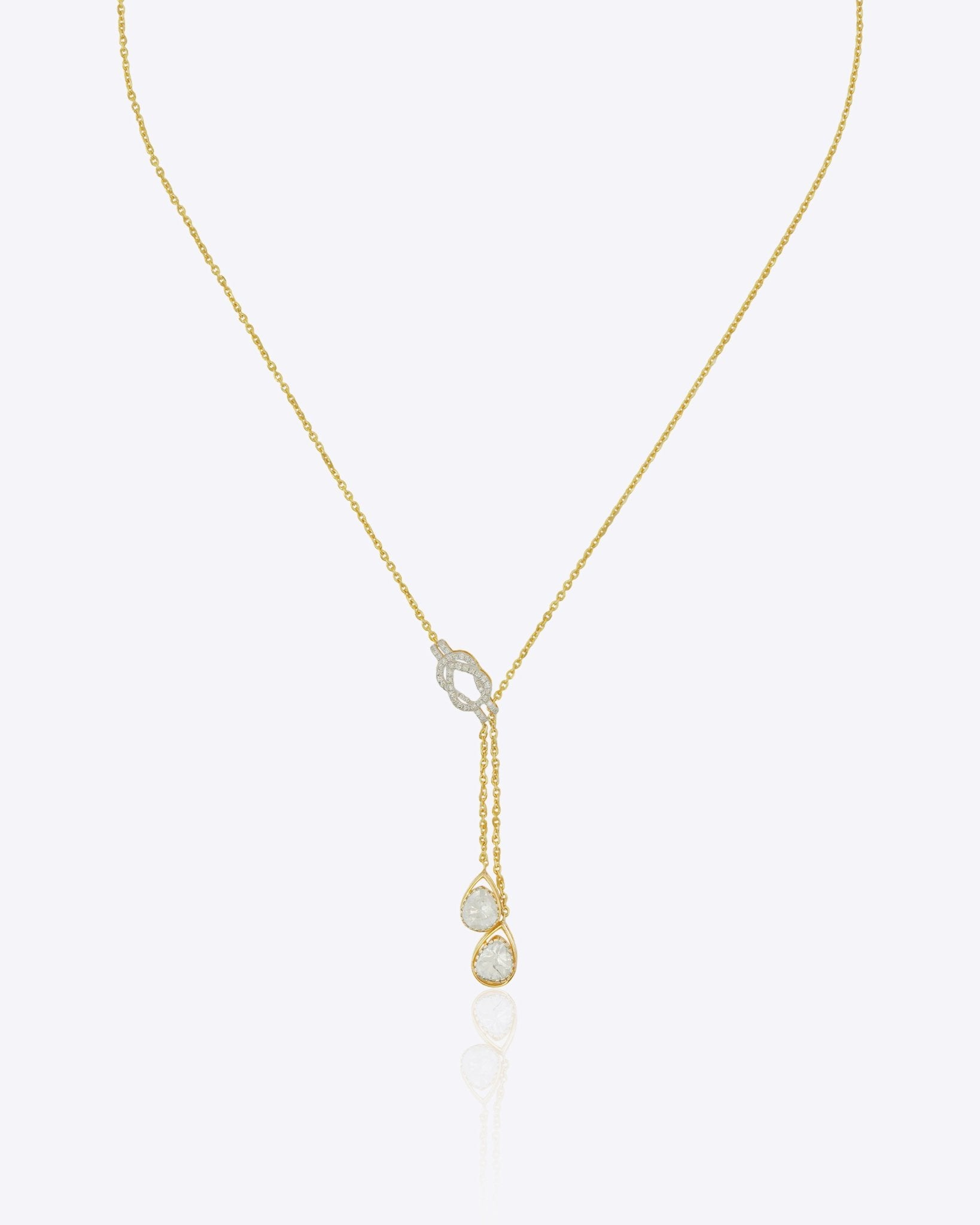 14kt gold lariat necklace featuring a central oval element and a vertical drop design for a graceful silhouette.