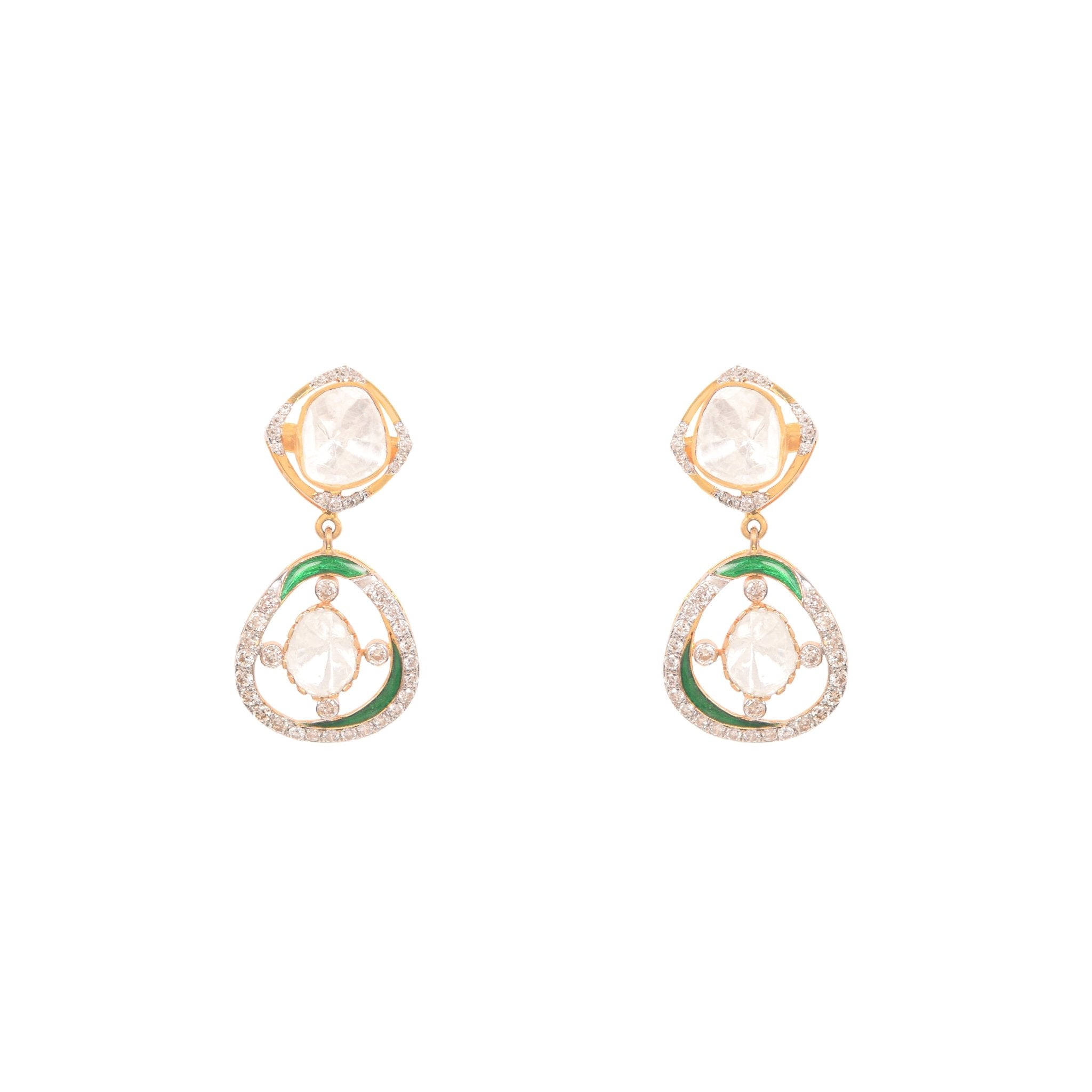 Teardrop-shaped polki studs with green enamel outline placed on natural moss backdrop.