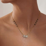 14K gold mangalsutra with round and oval Polki charms