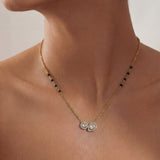 14K gold mangalsutra with round and oval Polki charms