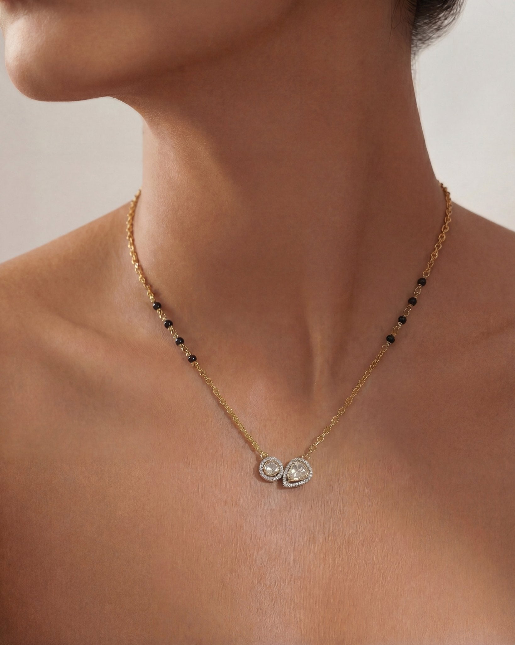 14K gold mangalsutra with round and oval Polki charms