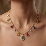 18k gold Navratna Grace necklace with colourful Navratna stones and drop detailing.