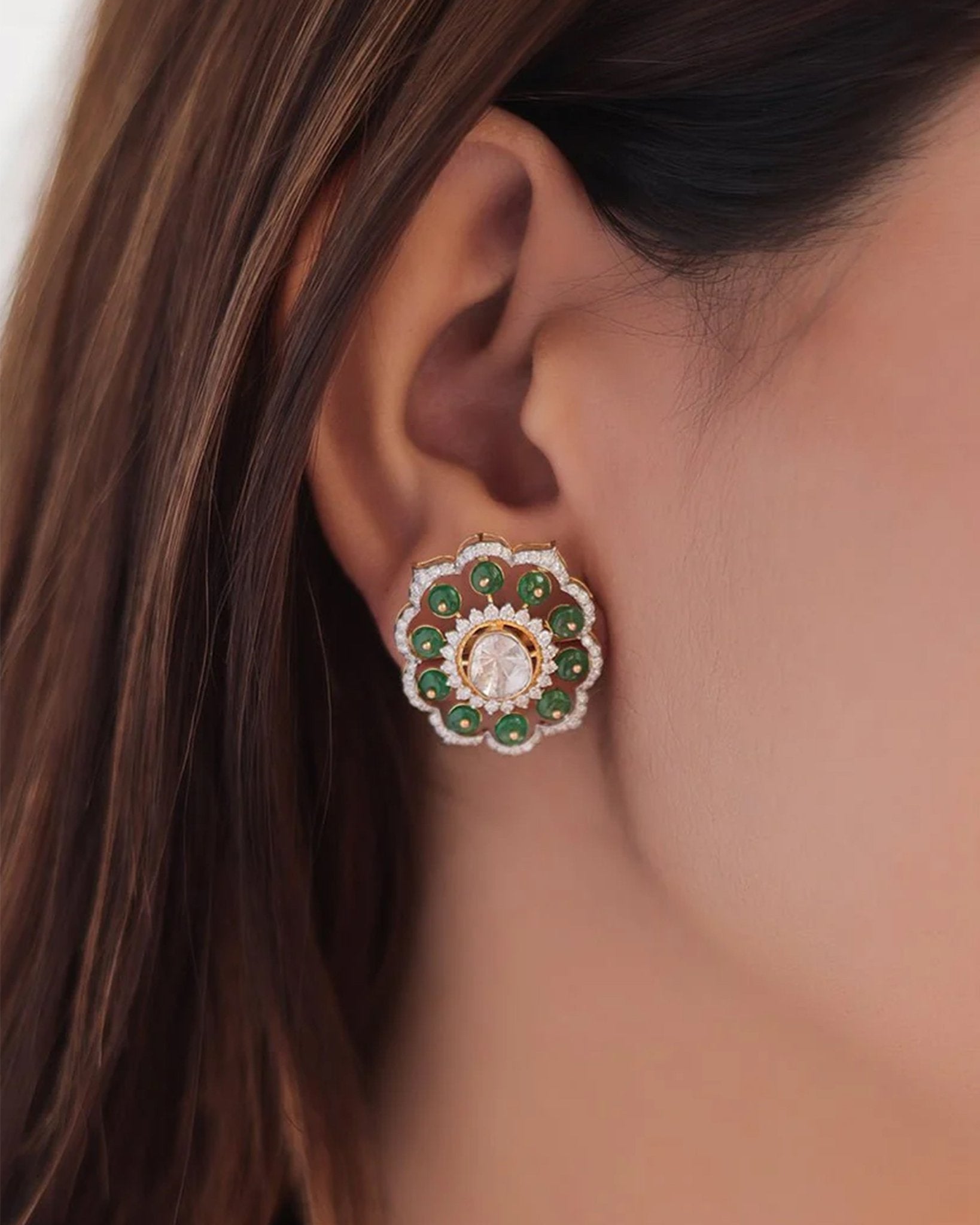 14K gold floral drop earrings set with Polki diamonds and emerald accents.