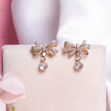 14kt gold bow-inspired drop earrings with delicate design
