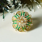 14K gold ring with a green talaf stone centerpiece and Polki diamonds.
