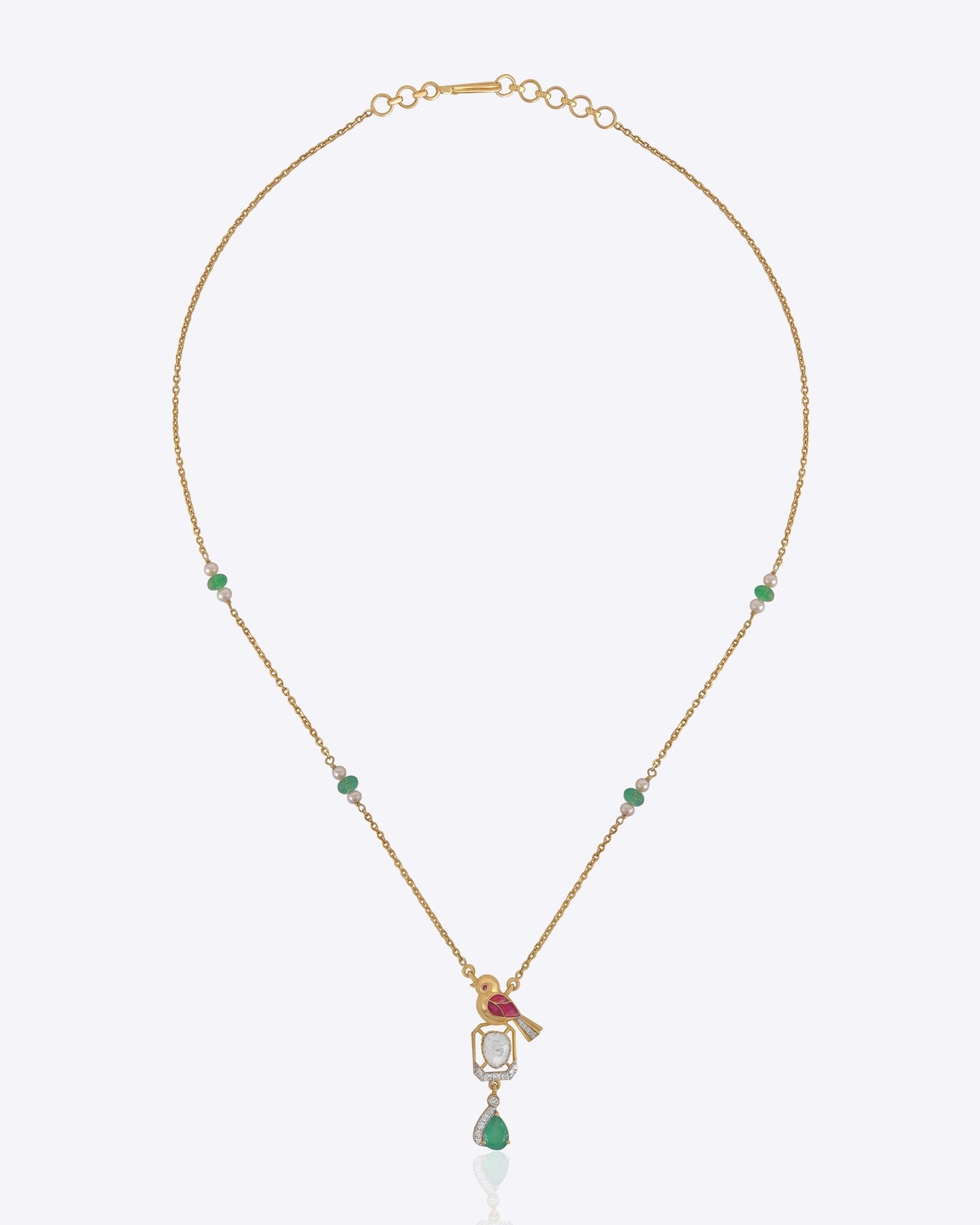 Serenade Pendant in 14k gold with a sculptural bird motif and Polki detailing