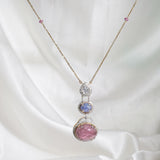 14k gold pendant with tourmaline, tanzanite, polkis, and diamonds on a gold chain