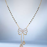 14K gold mangalsutra with Polki detailing and onyx accents