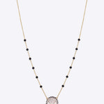 14K gold mangalsutra with a single round Polki pendant.