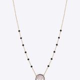 14K gold mangalsutra with a single round Polki pendant.