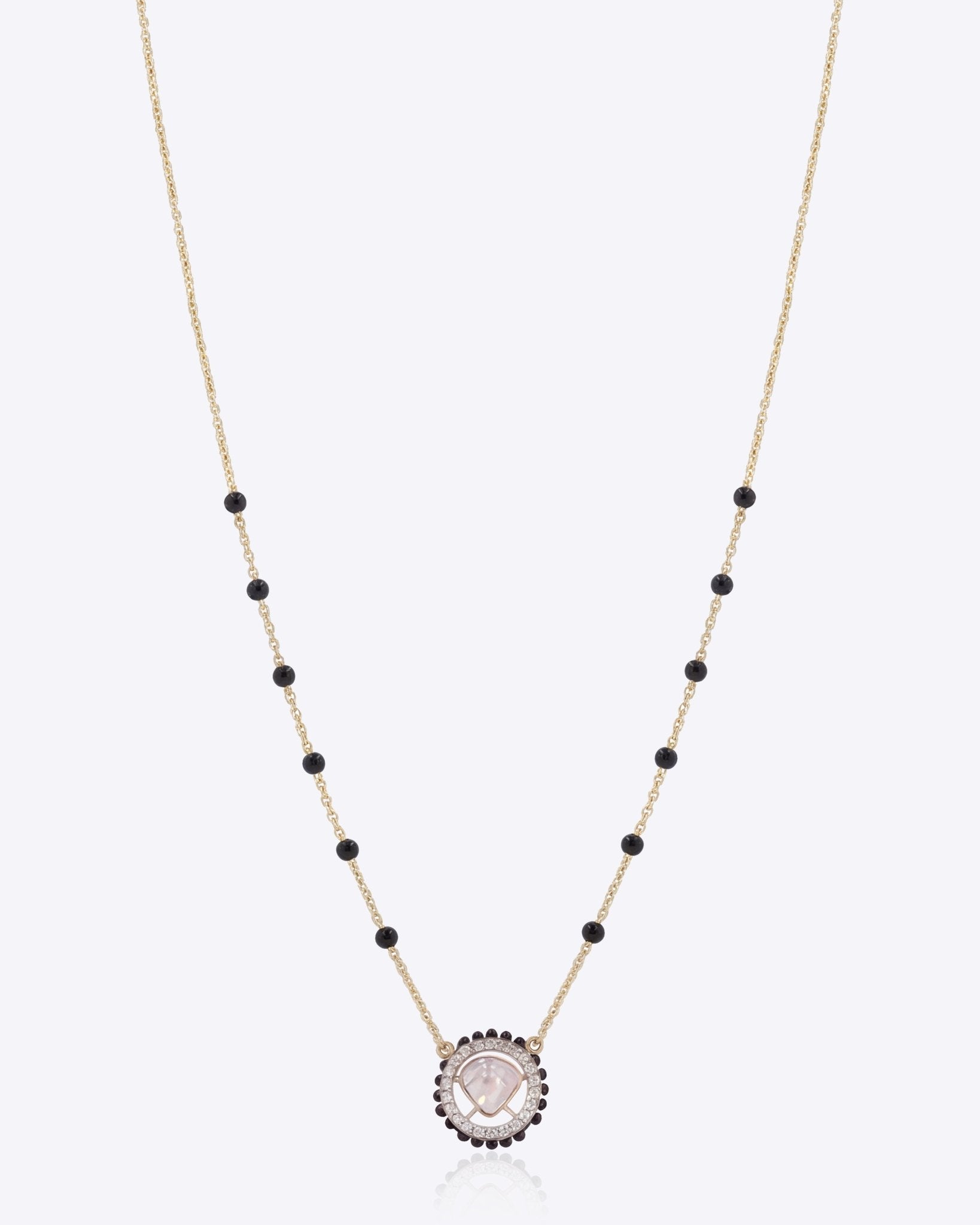 14K gold mangalsutra with a single round Polki pendant.