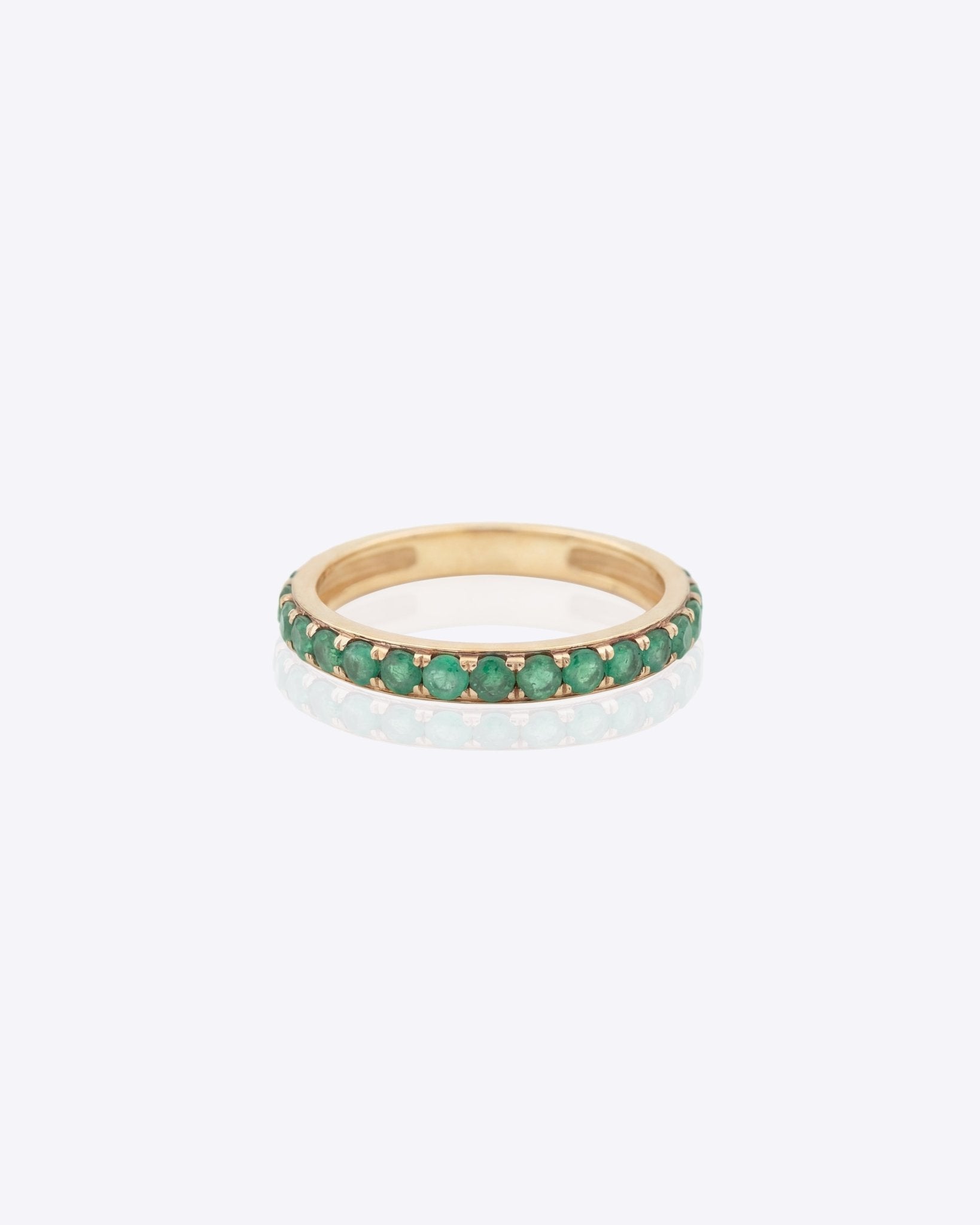 14K gold ring with radiant emeralds and diamond accents