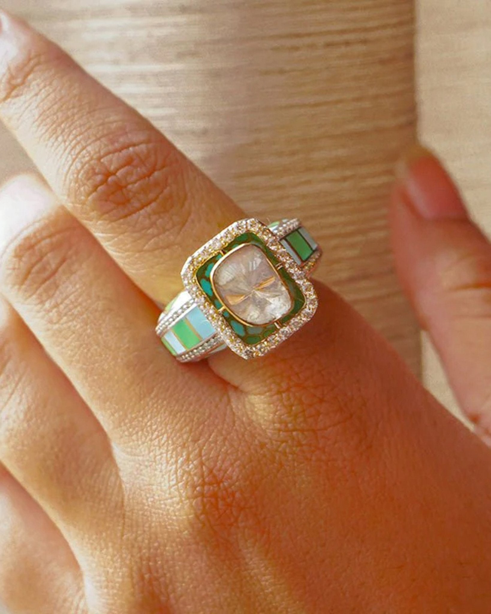 Gold ring with vibrant enamel detailing in a smooth, graceful band.