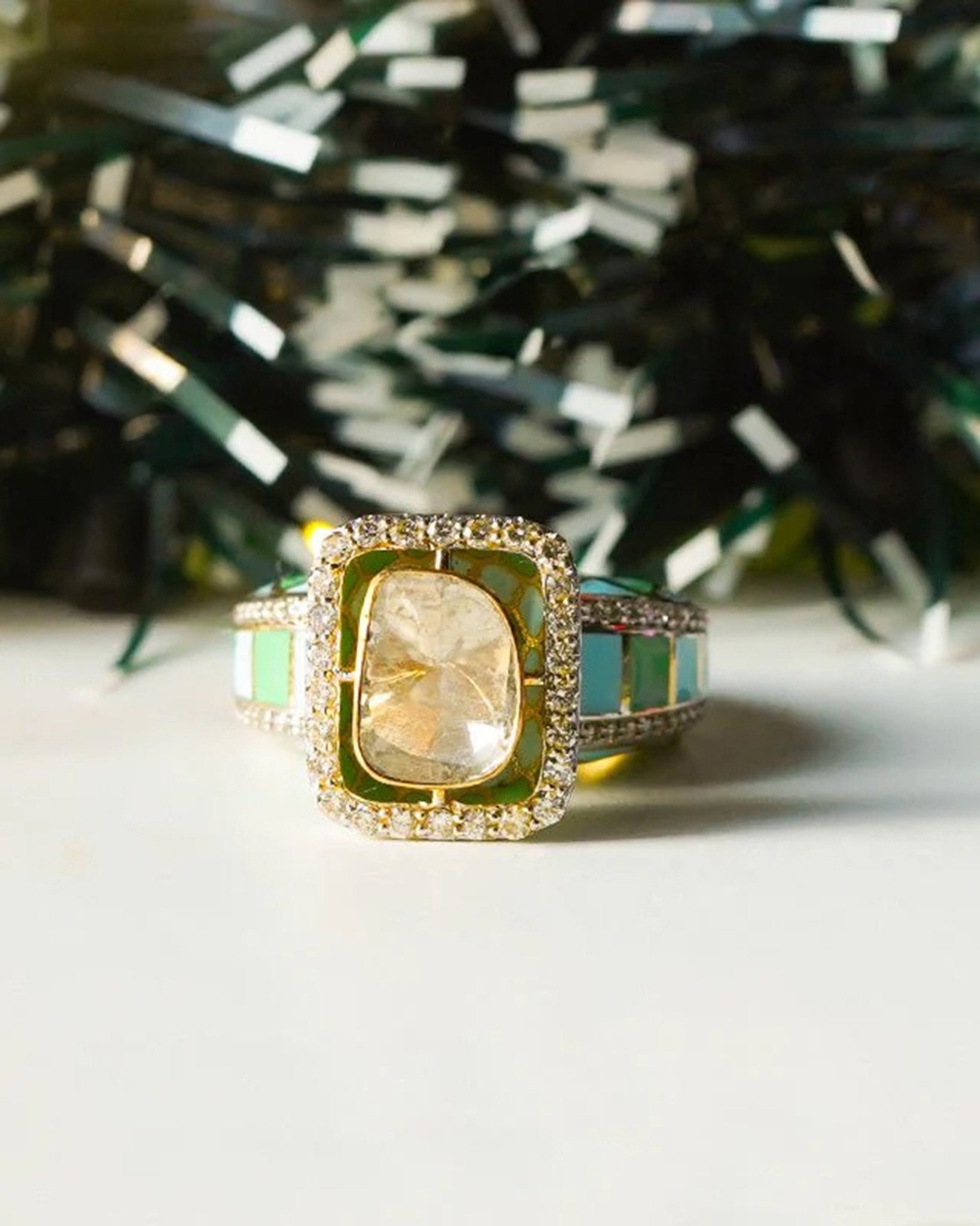 Gold ring with vibrant enamel detailing in a smooth, graceful band.