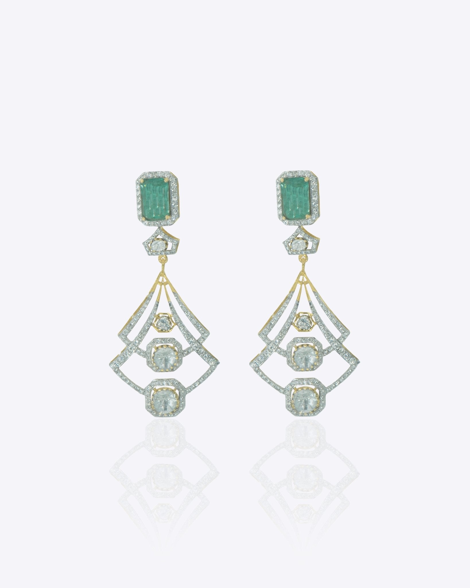 14K gold earrings with a geometric, fluid design